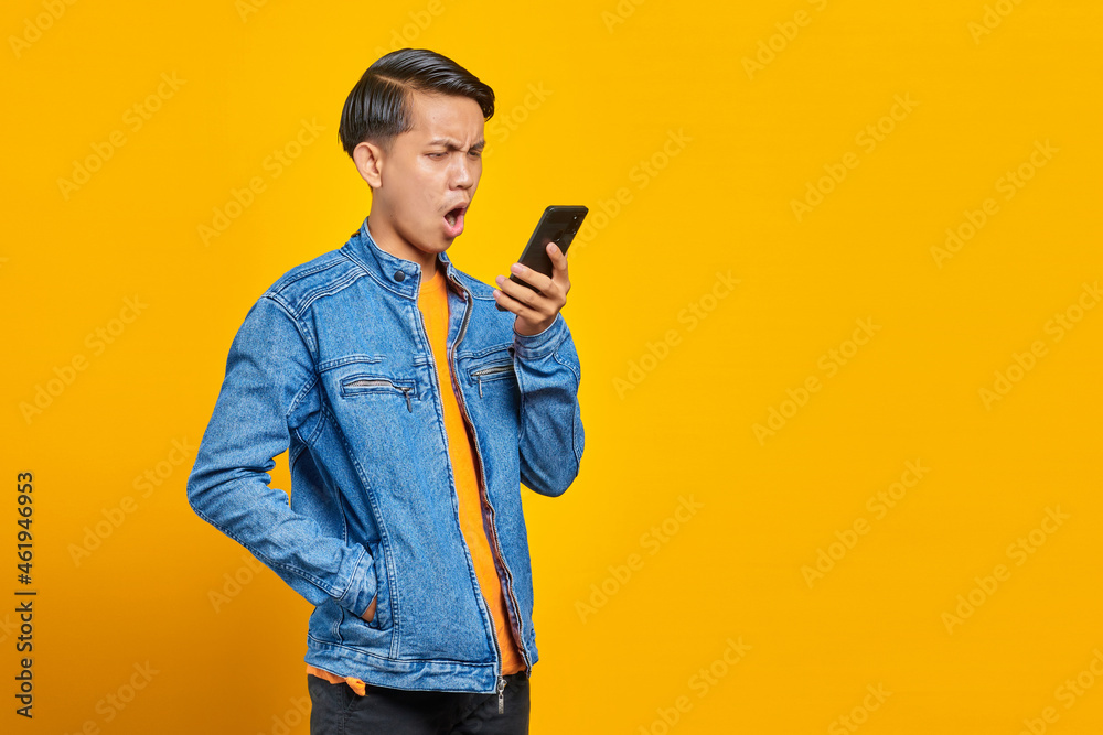 portrait of asian man angry when talk at smartphone portrait of asian man angry when talk at smartphone