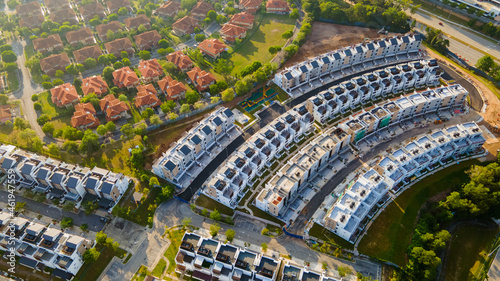 An aerial top down view of luxury residential neighbourhood during sunrise