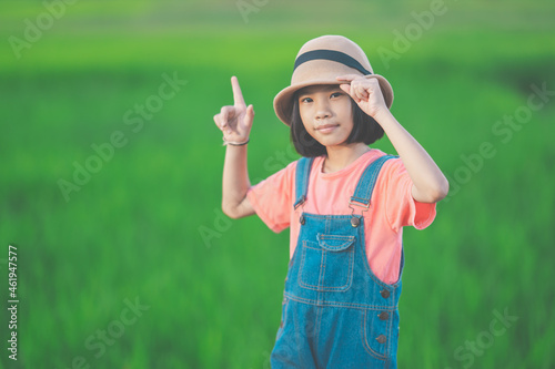 Happy children smile and posting on green nature background