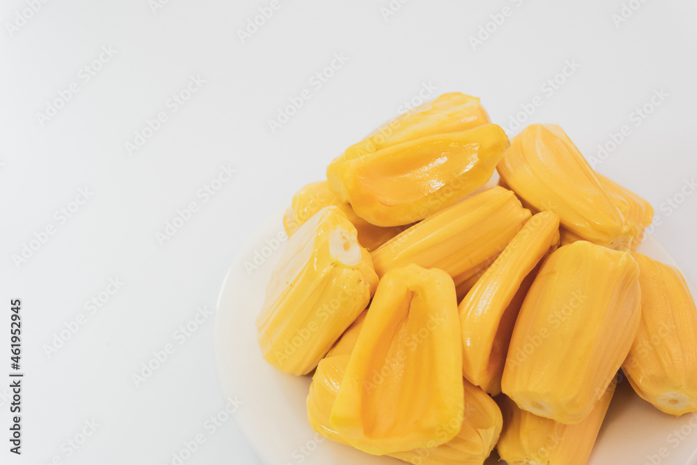 Ripe jack fruits isolated on white background. Fresh Jackfruit or Kathal in white plate, cutting jackfruit Ripe jack fruits isolated on white background. Fresh Jackfruit or Kathal in white plate, cutting jackfruit