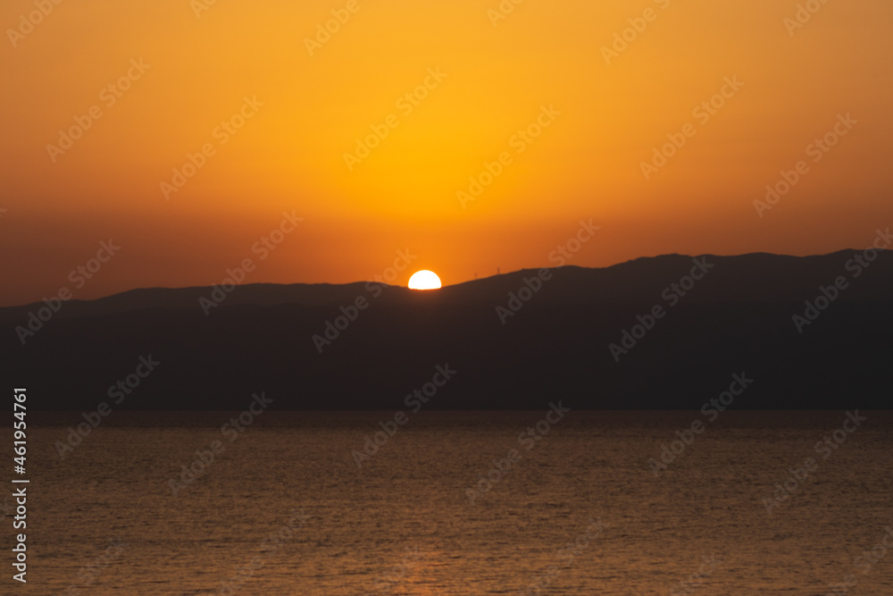 Sunrise in red and yellow over the mountains of the Dead Sea - Israel