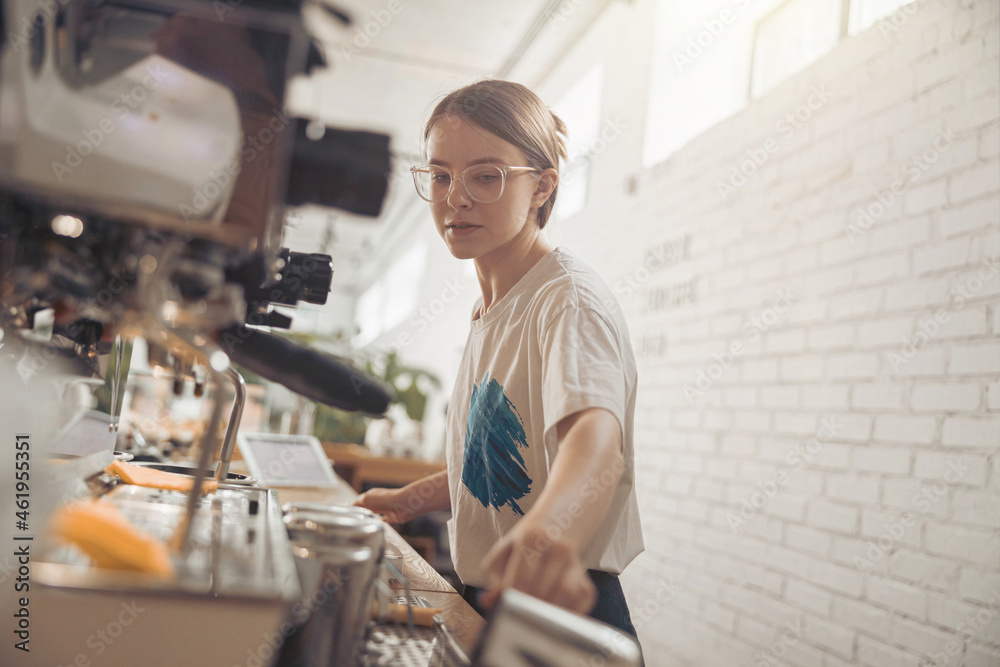 Beautiful young woman barista working in coffee shop Beautiful young woman barista working in coffee shop