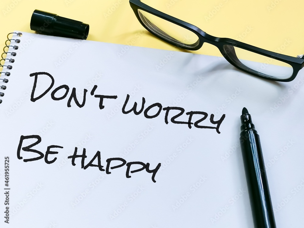 Notebook written do not worry be happy with marker pen an eye glasses. Notebook written do not worry be happy with marker pen an eye glasses.