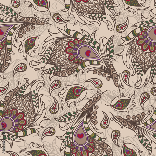 Vector illustration. Ethnic wallpaper from decorative feathers. Luxurious seamless pattern of peacock feathers in oriental, Indian style. Background for fabrics, textiles, postcards and bed linen.