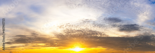 The yellow sunrise and fluffy clouds on morning sky, nature panorama picture.