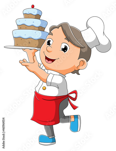 The chef boy is holding a cake