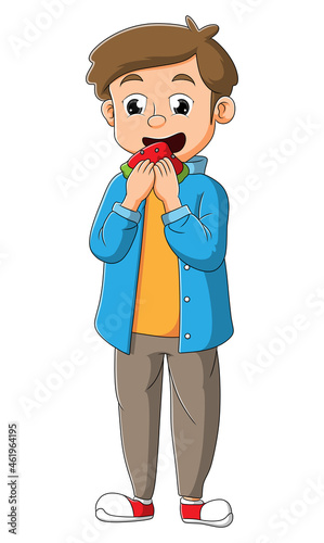 The young man is eating a slice of watermelon