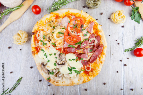 italian pizza on a wooden background with decoration around
