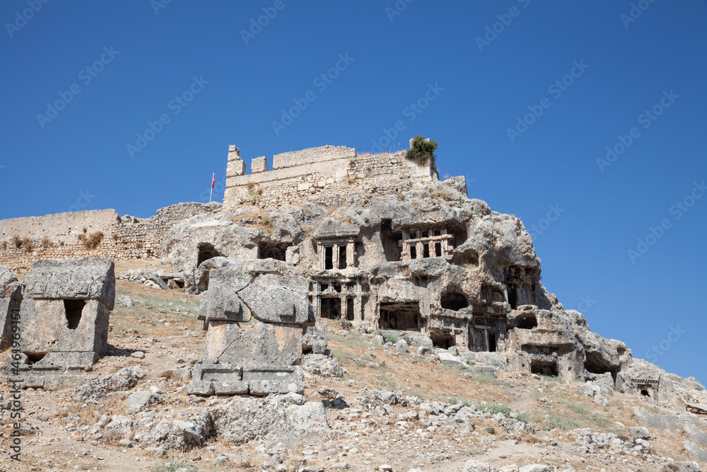 Fototapeta premium Tlos, Ruins of the ancient town over blue sky near the city of Fethiye, Mugla province, Turkey.