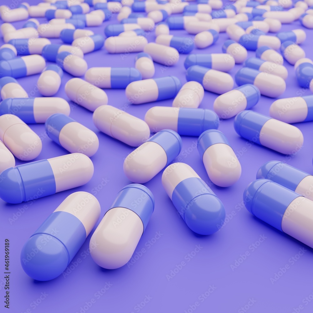 Selective focus on blue and white capsules pill on blue background. Antimicrobial capsule pills.
