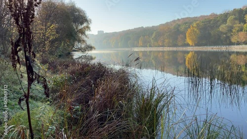 4K bright sunny autumn morning video of foggy Moscow River and yellow red forest in Moscow, Russia photo