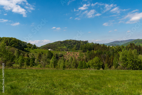 Sprngtime Slezske Beskydy mountains scenery from hiking trail bellow Filipka hill summit in Czech republic photo