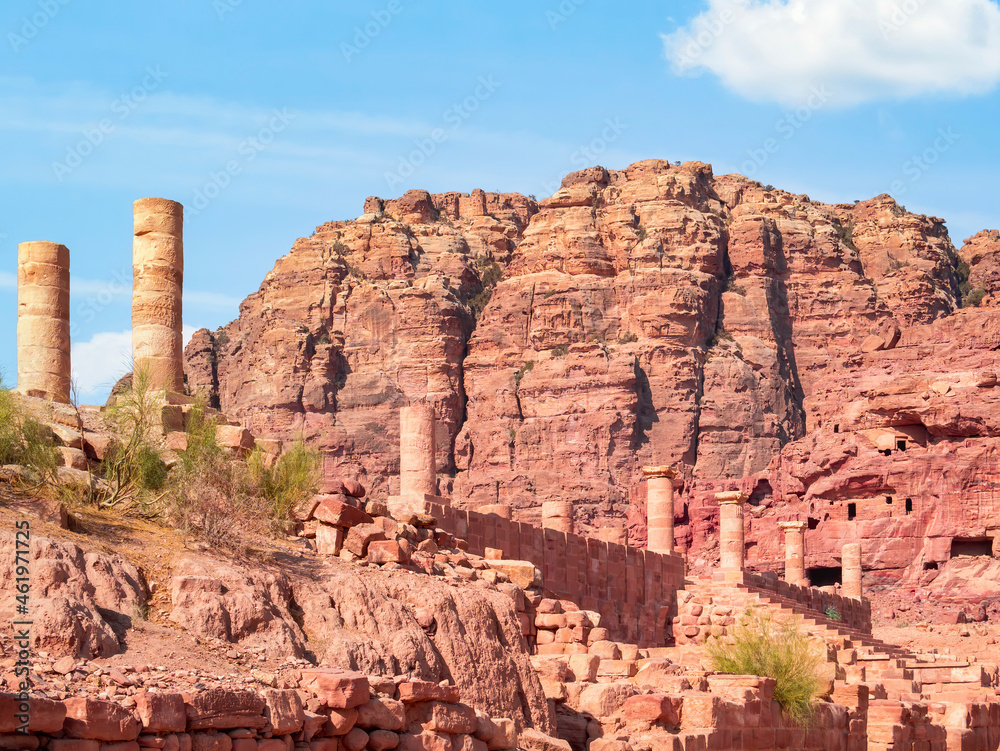 Fototapeta premium The Colonnaded Street in the ancient city of Petra, Jordan and a red rock mountain in the background