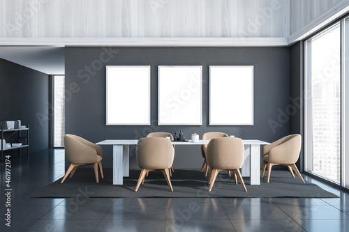 Three canvases on wall of dining room with grey and beige design
