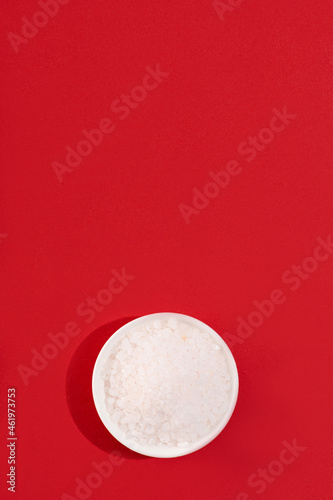 Plate with white salt on a red