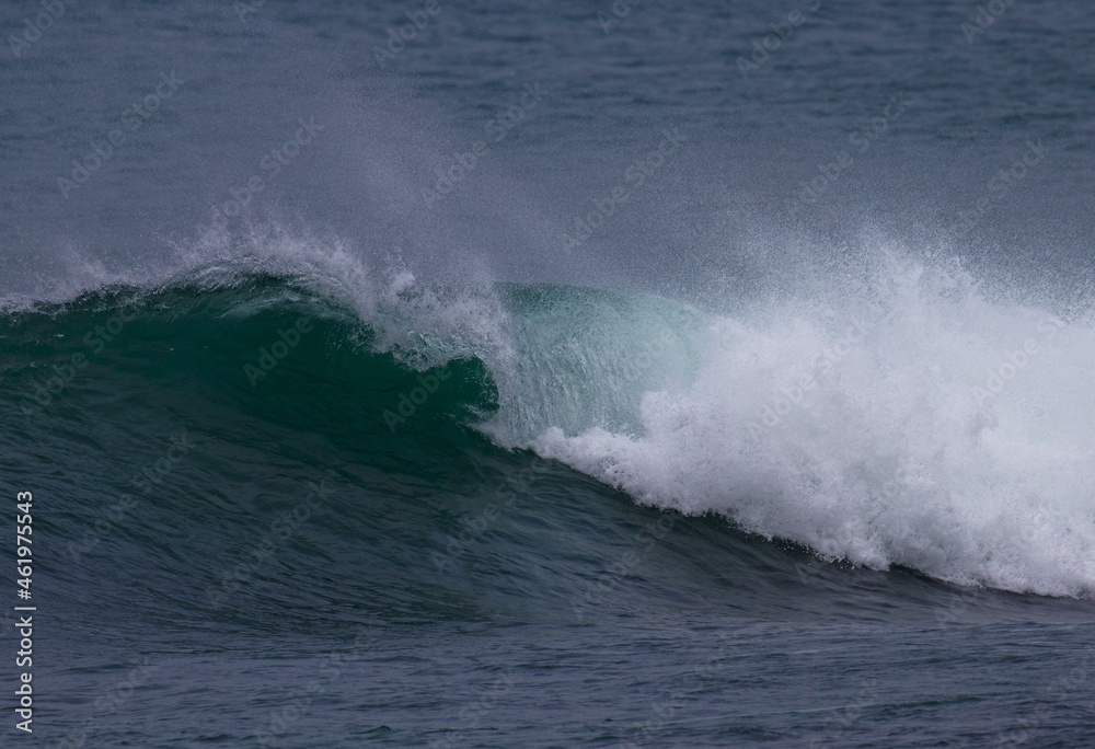 A foamy, breaking wave on the sea A foamy, breaking wave on the sea