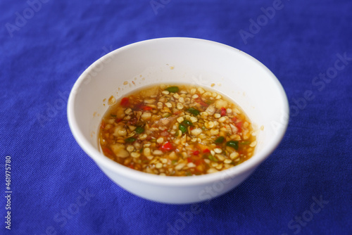 Thai style seafood sauce in a plastic cup