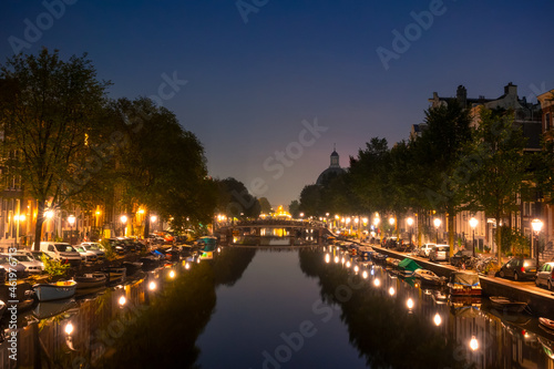 Night Canal in Amsterdam With Parked Boats and Cars