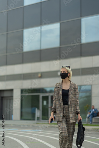 Portrait of walking businesswoman