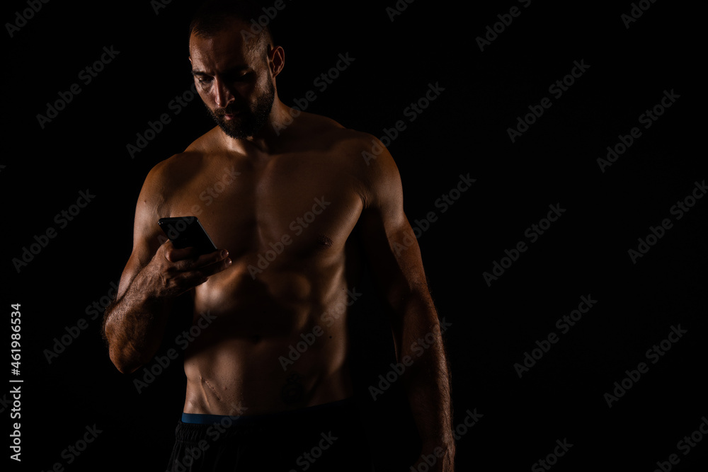 Portrait of guy checking his phone on his break