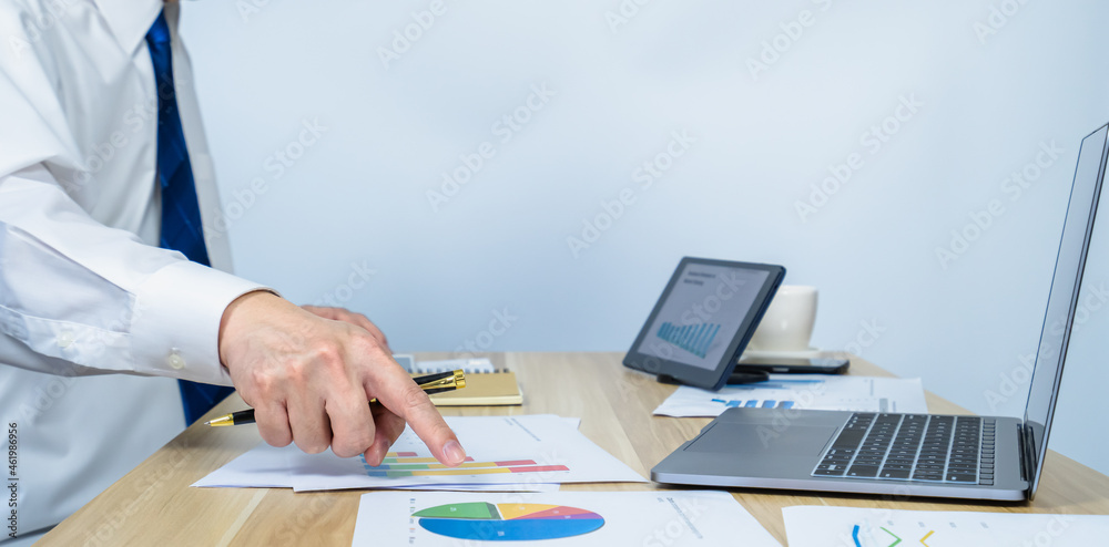 executive point data graph on document on working desk by hand executive point data graph on document on working desk by hand
