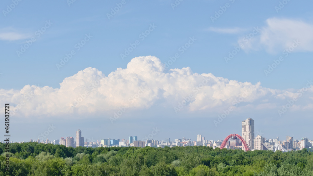 Summer Moscow landscape with large clouds in the sky. View from Krylatskoye Hills