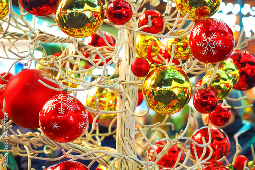 Many large golden and red balls, New Year and Christmas tree decorations, beautiful Christmas background. Street decorations in Europe