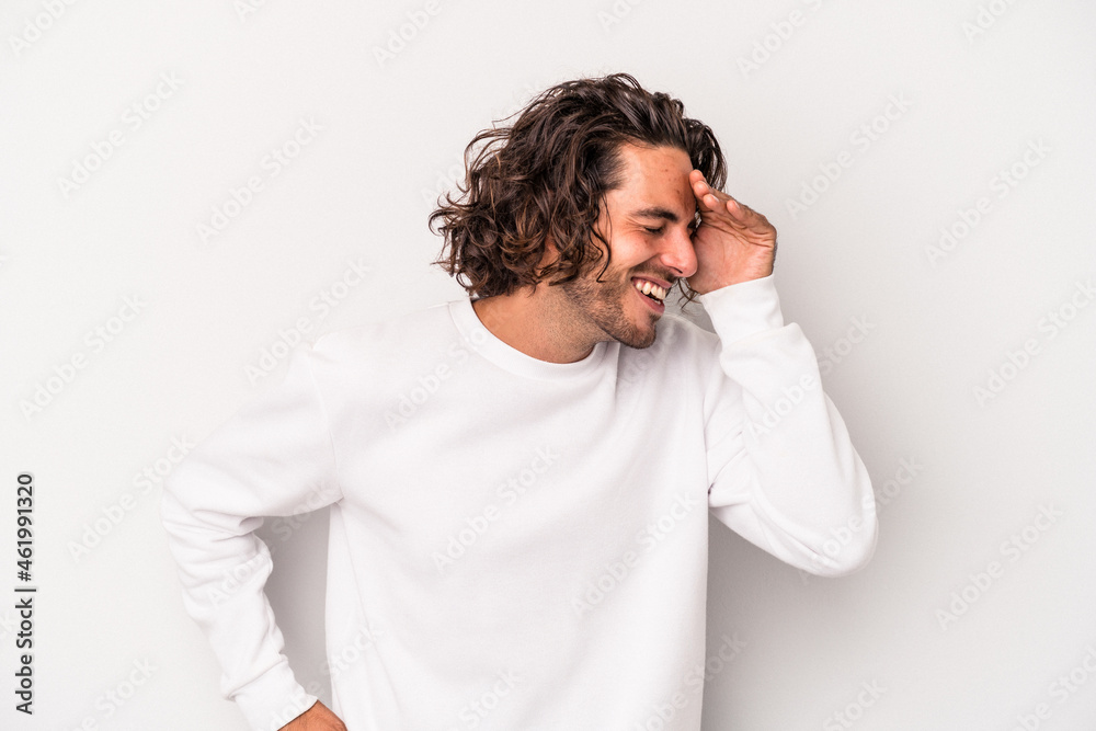 Young caucasian man isolated on gray background joyful laughing a lot. Happiness concept. Young caucasian man isolated on gray background joyful laughing a lot. Happiness concept.