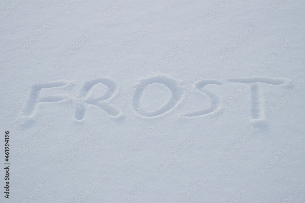 inscription of frost on the snow. children wrote frost in the snow. cold season. inscription of frost on the snow. children wrote frost in the snow. cold season.