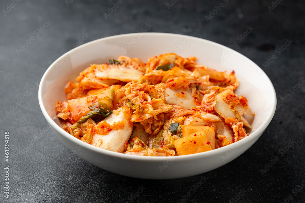 Traditional Korean Kimchi Cabbage in white bowl. Healthy food.