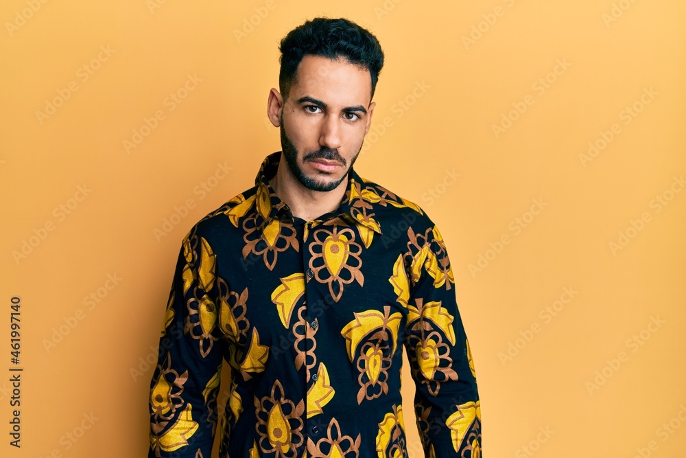 Young hispanic man wearing casual shirt depressed and worry for distress, crying angry and afraid. sad expression. Young hispanic man wearing casual shirt depressed and worry for distress, crying angry and afraid. sad expression.