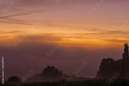 Early morning fog during a colourful sunrise in Maastricht  the Netherlands. These kind of mornings are often seen in the Autumn season
