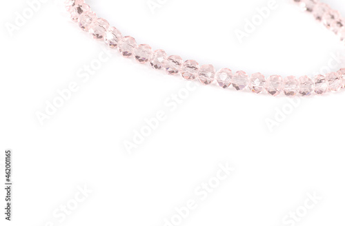 Bracelets natural stones in gentle pink colors, isolated on white background. Free space for text. Selected focus.