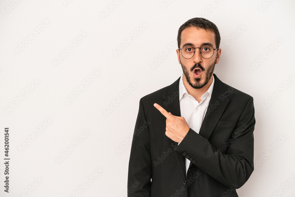 Young caucasian business man isolated on white background pointing to the side Young caucasian business man isolated on white background pointing to the side