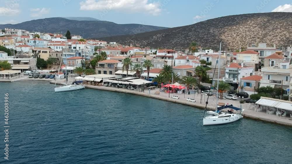 Aerial panoramic photo of picturesque seaside town of Ermioni built in peninsula with forest of Bistis at the end, Argolida, Peloponnese, Greece Aerial panoramic photo of picturesque seaside town of Ermioni built in peninsula with forest of Bistis at the end, Argolida, Peloponnese, Greece