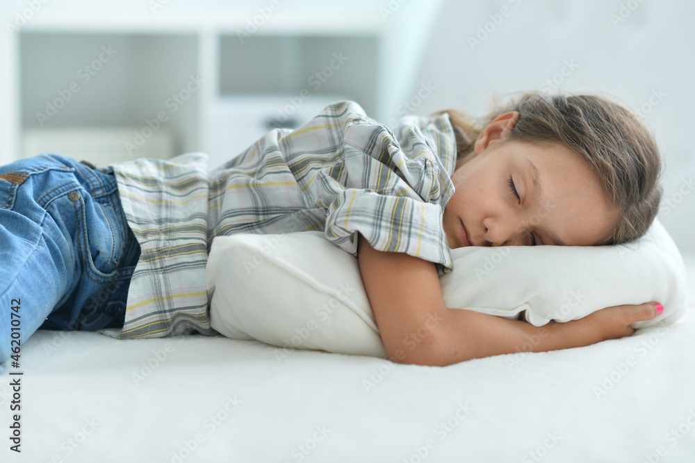 Porait of cute little girl sleeping in bed at home Porait of cute little girl sleeping in bed at home