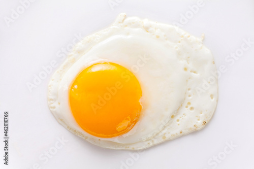 fried egg isolated on white background. top view.