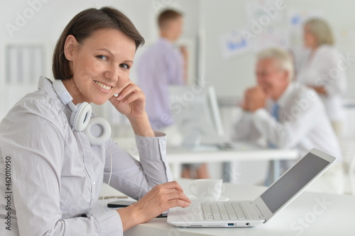 portrait of a young woman with a laptop