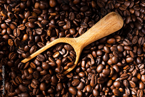 Roasted Coffee Beans Background Texture and Wooden Spoon