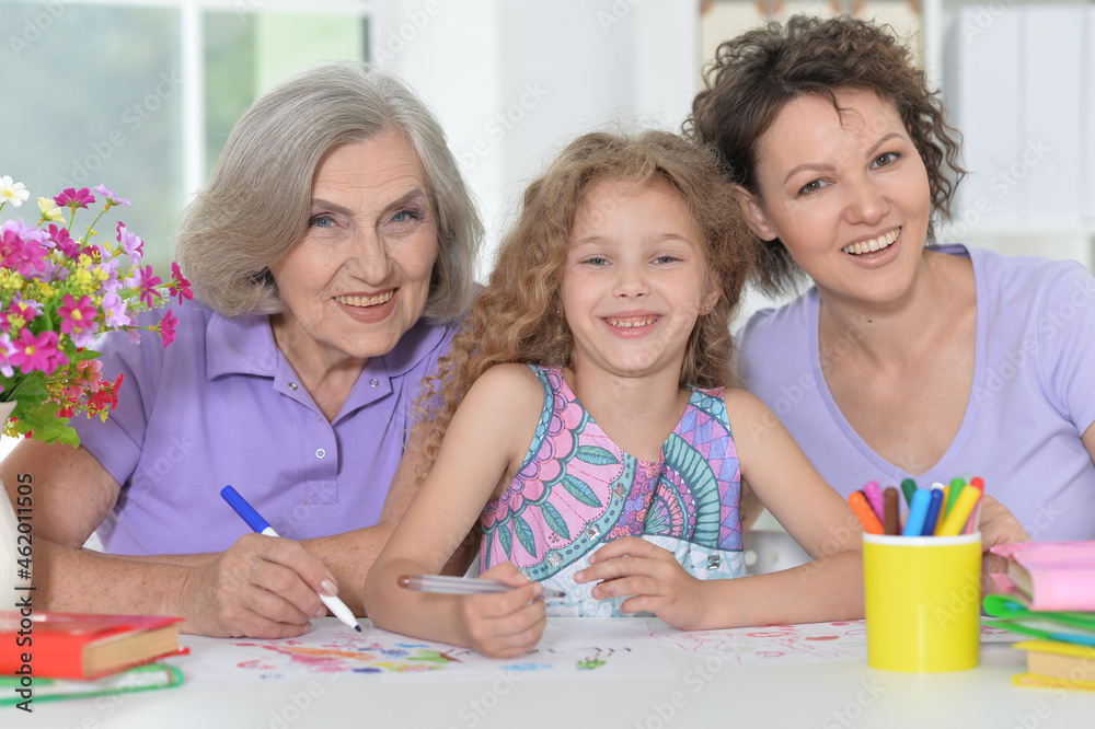 Mother, grandmother and girl drawing together Mother, grandmother and girl drawing together