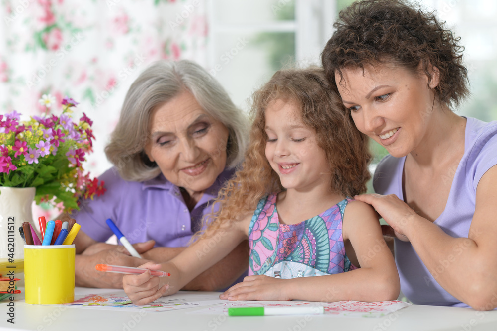 Mother, grandmother and girl drawing together Mother, grandmother and girl drawing together