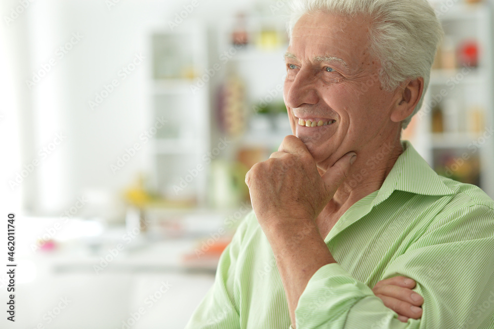 portrait of senior man smiling at home