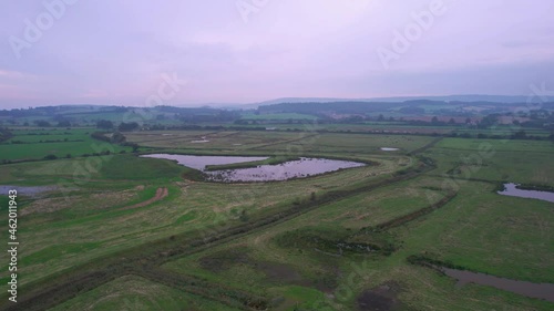 Wetlands and meadows in RSPB Exminster and Powderham Marshe from a drone, Exeter, Devon, England photo