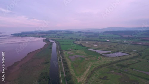 Wetlands and meadows in RSPB Exminster and Powderham Marshe from a drone, Exeter, Devon, England photo