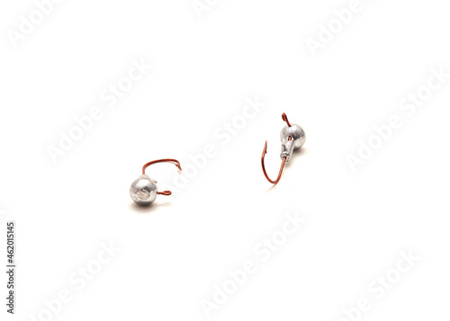 Two ball head jig fishing tackles with lightweight leadhead and aberdeen hook isolated on white photo