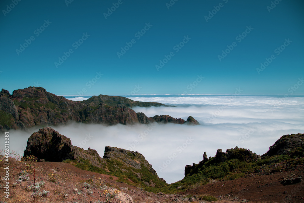 Huge mountains and hills above clouds in Pico do Arieiro at Madeira Island
