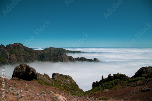 Huge mountains and hills above clouds in Pico do Arieiro at Madeira Island