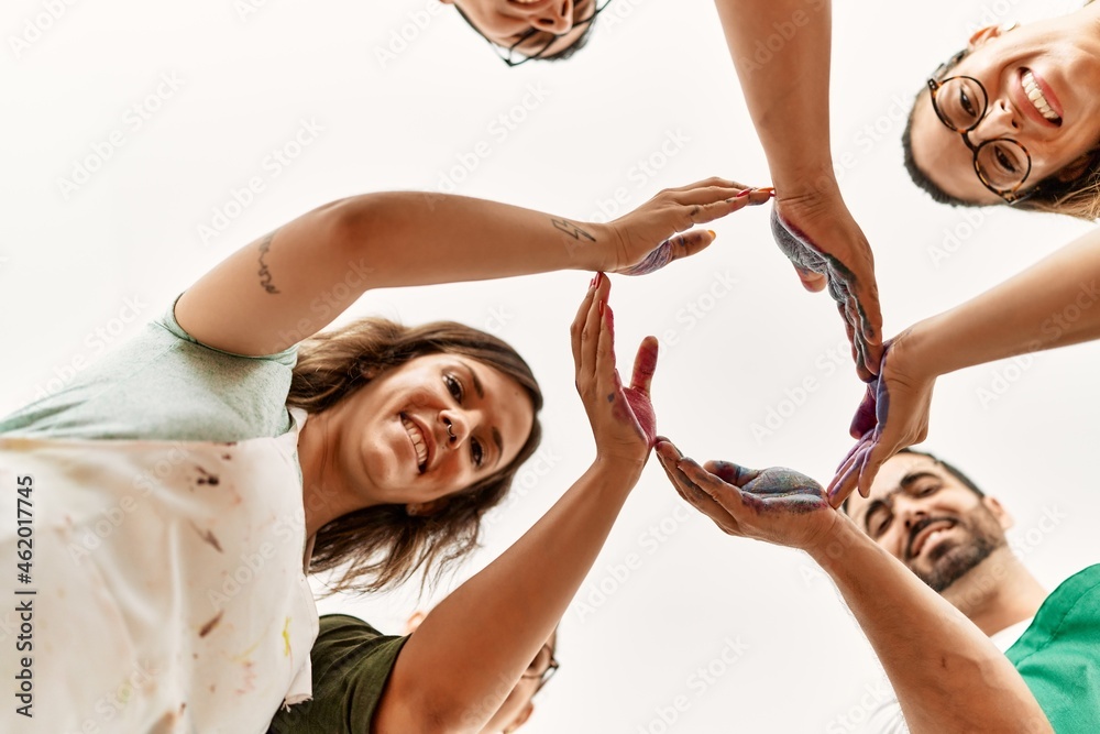 © Krakenimages.com - Group of people smiling happy with hands together art studio. © Krakenimages.com - Group of people smiling happy with hands together art studio.