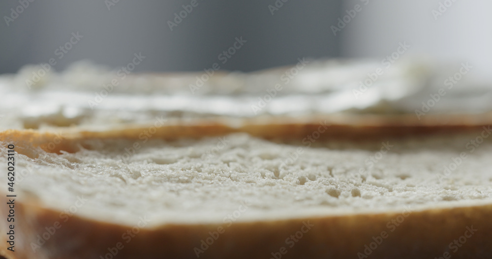 cream cheese on fresh baguette slice to make sandwich closeup cream cheese on fresh baguette slice to make sandwich closeup