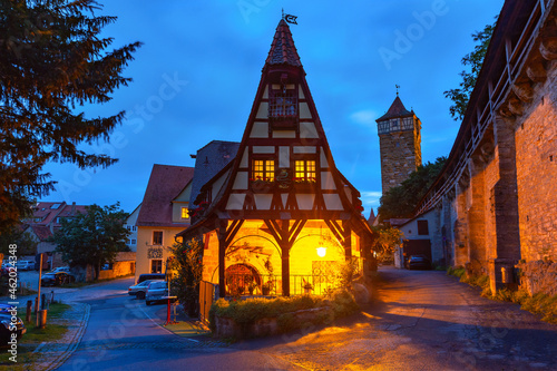 Night town wall and Gerlachschmiede, Gerlach Blacksmith house, beautiful half-timbered house in Rothenburg ob der Tauber, Bavaria, southern Germany